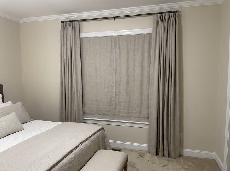 Curtains and drapery on a guest bedroom window in a 1990s brick colonial in Woodstock