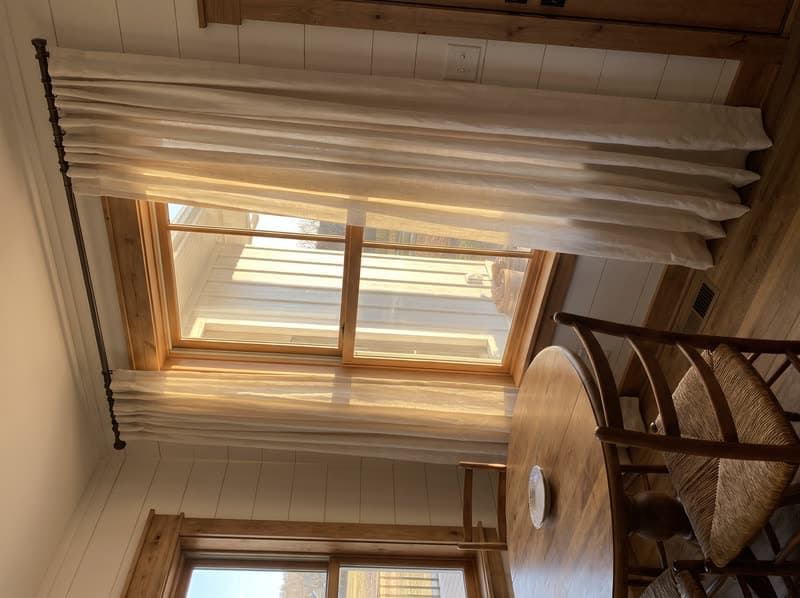 Curtains and drapery on a breakfast nook window in a modern farmhouse in Canton