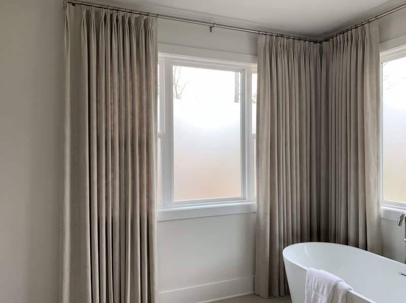 Curtains and drapery on a bathroom window in a new build in a modern subdivision in Sandy Springs