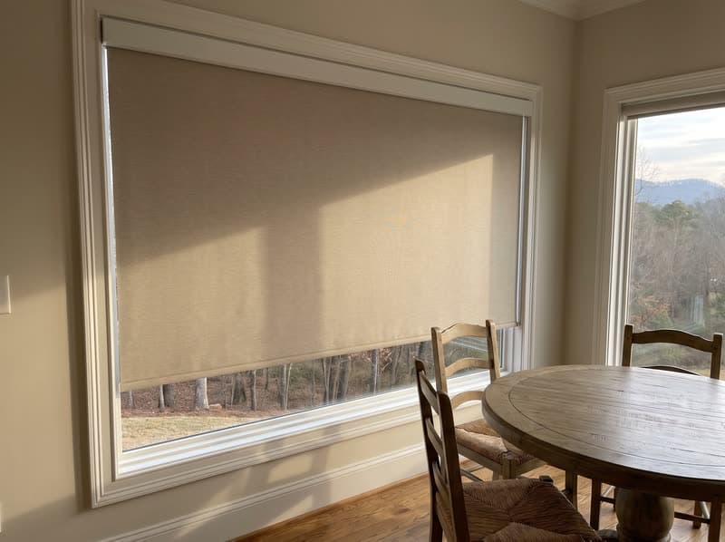 Roller shade on a breakfast nook window in a modern farmhouse in Canton