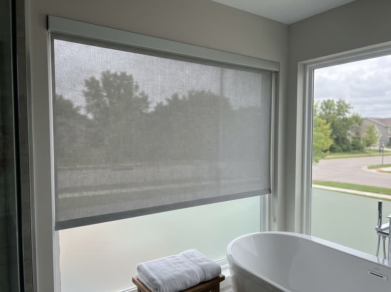 Roller shade on a bathroom window in a new build in a modern subdivision in Sandy Springs