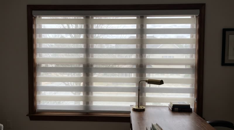 Zebra shade on a home office window in a traditional two-storey house in Johns Creek