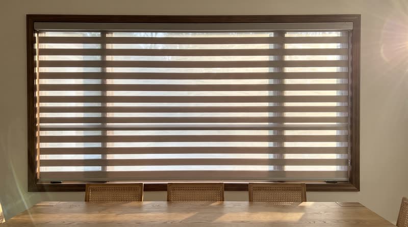 Zebra shade on a dining room window in a luxury modern villa in Roswell