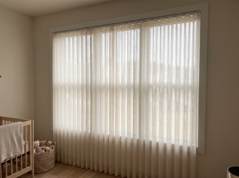 Dream curtain vertical sheer on a nursery window in a new build in a modern subdivision in Suwanee